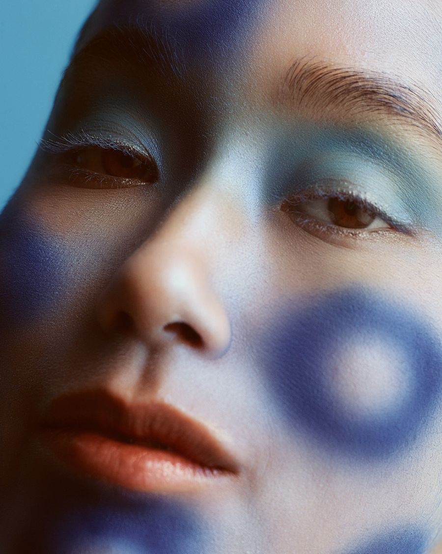 Close-up beauty with airbrushed blue blush and eyeshadow